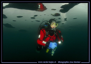 Having fun under the Ice... My friend Stéphane in a small... by Michel Lonfat 